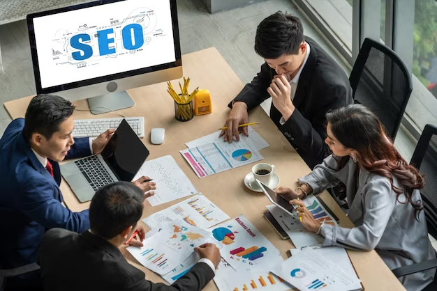 People sitting in an office and discussing SEO strategy