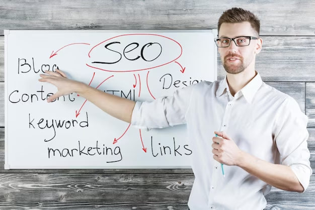 A man stands near a board on which SEO strategy