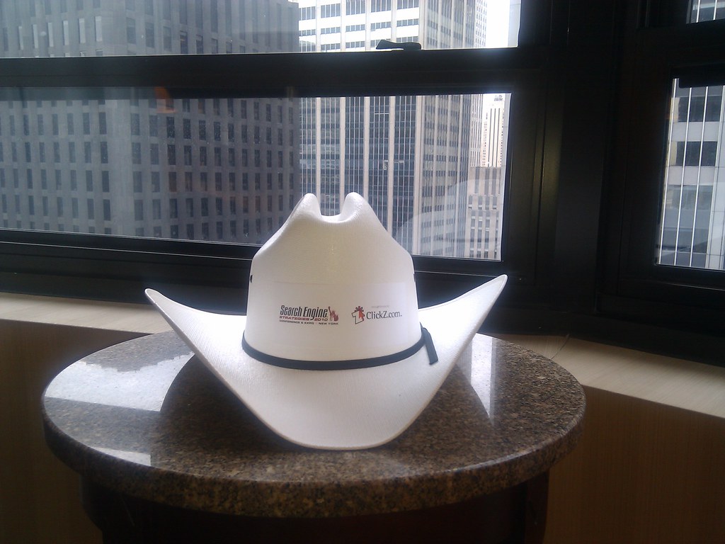 a white cowboy hat on a table