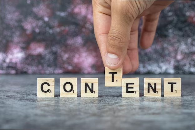 Hands form word content from wooden cubes